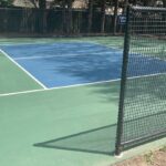 Angled Tennis court with green and blue ground.