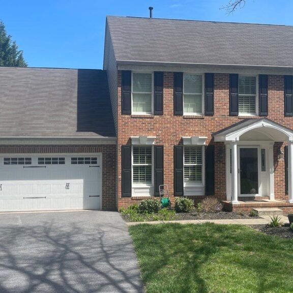 Large brick house with a side garage,